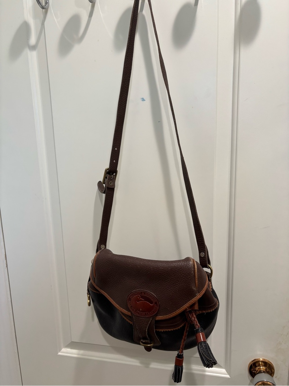 Dooney & Bourke Dark Brown Leather Saddle Bag with Tan Trim
